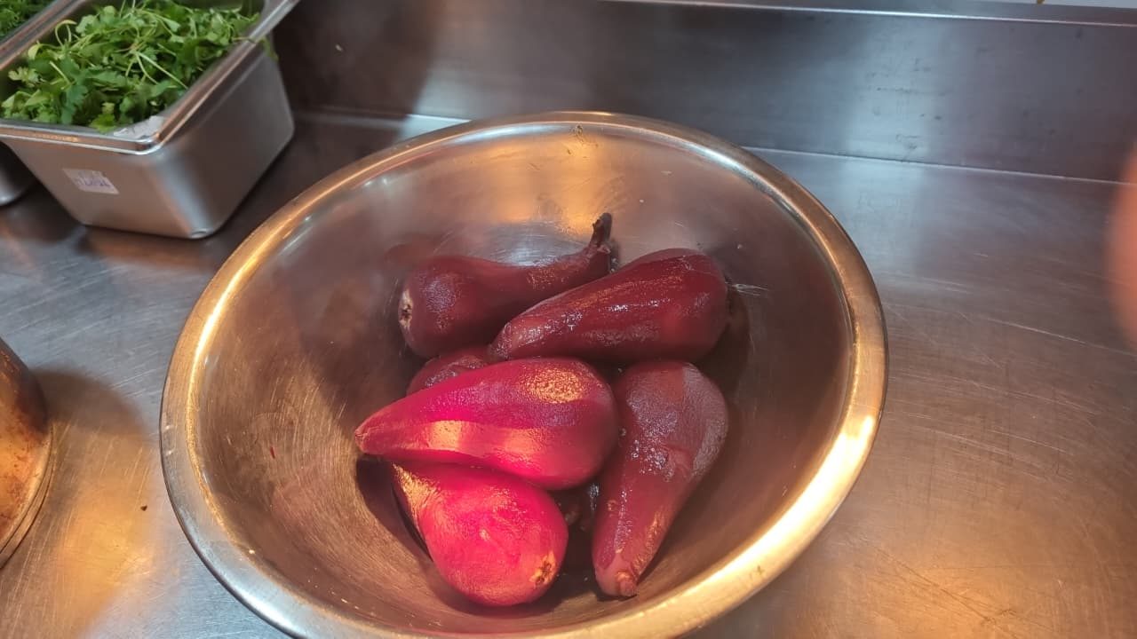 Red-wine poached pears ready for plating